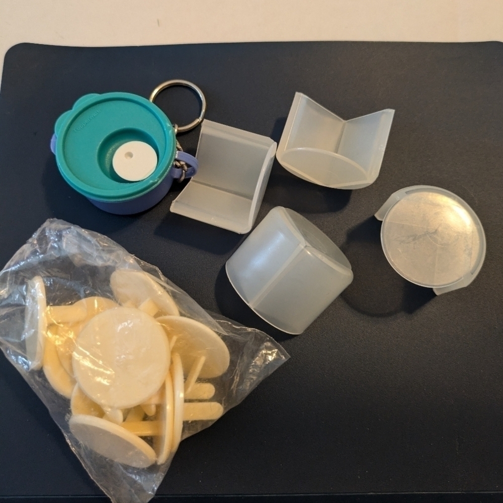 Tupperware lot. Table corner protectors and outlet covers. Bowl keychain
